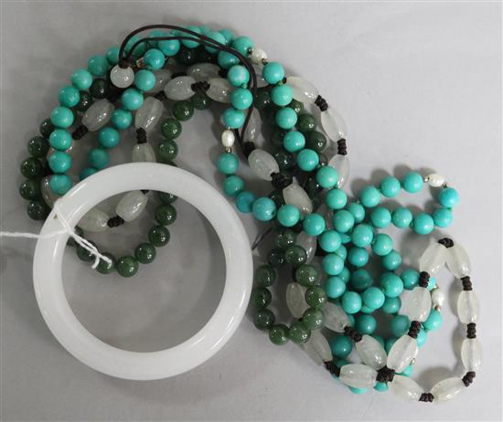 Three hardstone bead necklaces and a bangle.
